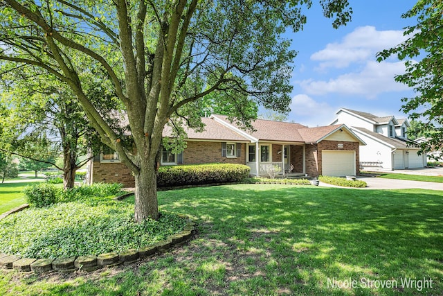 4124 Cummings Ct NW, Grand Rapids, MI 49534 - single story home featuring brick siding, an attached garage, concrete driveway, and a front lawn