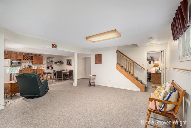 4124 Cummings Ct NW, Grand Rapids, MI 49534 - living room featuring stairway and light carpet