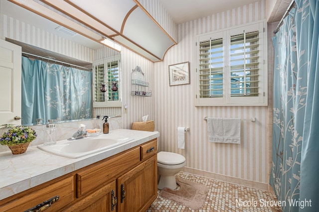 4124 Cummings Ct NW, Grand Rapids, MI 49534 - full bath featuring wallpapered walls, vanity, toilet, tile patterned floors, and curtained shower