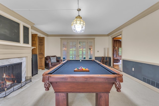 5340 Squires Manor Rd, Jackson, MI 49201 - recreation room featuring french doors, light carpet, crown molding, billiards, and a fireplace