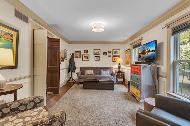 5340 Squires Manor Rd, Jackson, MI 49201 - living area with crown molding, wainscoting, wood finished floors, and a decorative wall