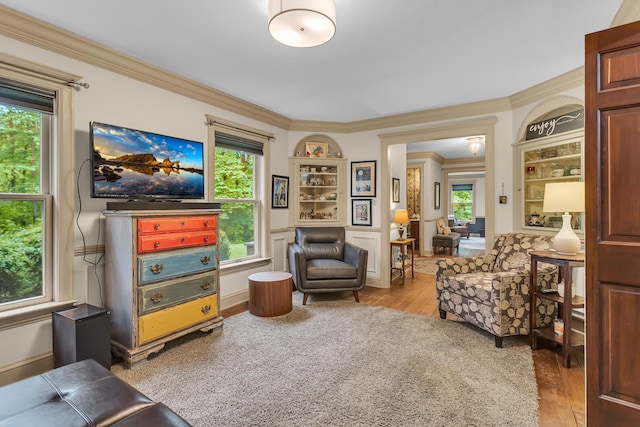 5340 Squires Manor Rd, Jackson, MI 49201 - living area with hardwood / wood-style floors, ornamental molding, plenty of natural light, and built in features