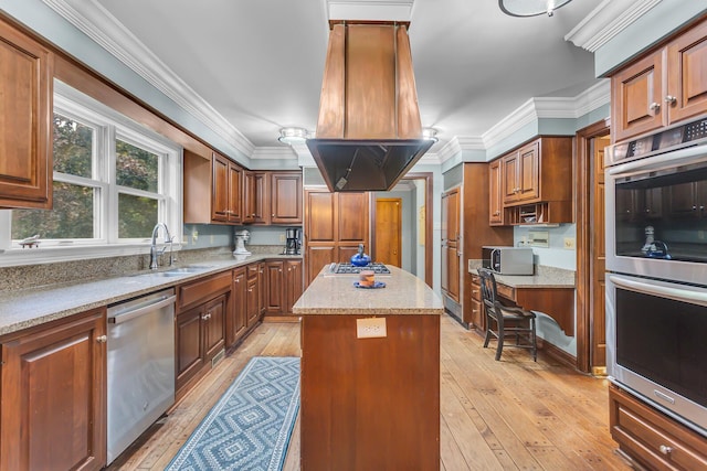 5340 Squires Manor Rd, Jackson, MI 49201 - kitchen featuring appliances with stainless steel finishes, a sink, island range hood, a kitchen island, and light wood finished floors