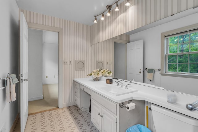 5340 Squires Manor Rd, Jackson, MI 49201 - bathroom with wallpapered walls, vanity, tile patterned floors, and baseboards