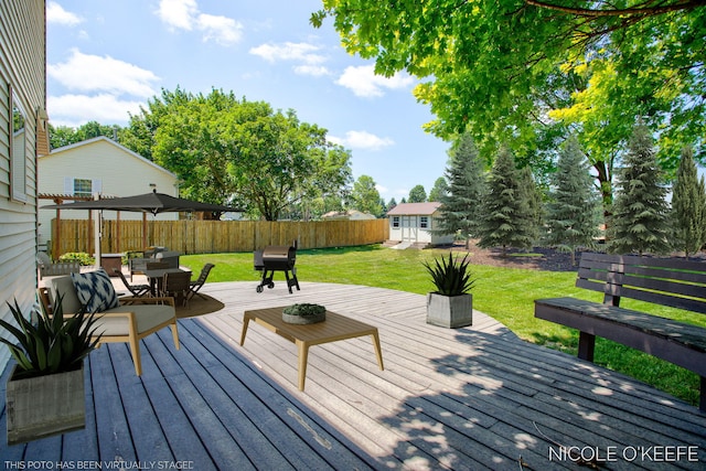 7745 Worthing Ct SW, Byron Center, MI 49315 - wooden deck with a fenced backyard, an outbuilding, and outdoor dining space