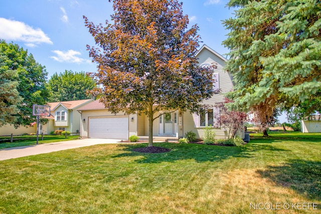 7745 Worthing Ct SW, Byron Center, MI 49315 - view of property hidden behind natural elements with concrete driveway, a garage, and a front lawn