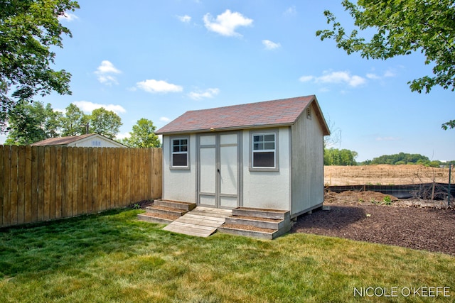 7745 Worthing Ct SW, Byron Center, MI 49315 - view of shed with a fenced backyard and entry steps