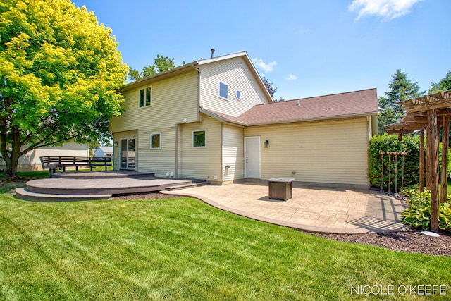 7745 Worthing Ct SW, Byron Center, MI 49315 - rear view of property featuring a yard, a wooden deck, and a patio