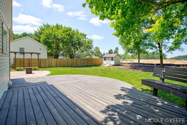 7745 Worthing Ct SW, Byron Center, MI 49315 - wooden deck featuring a fenced backyard and a storage shed