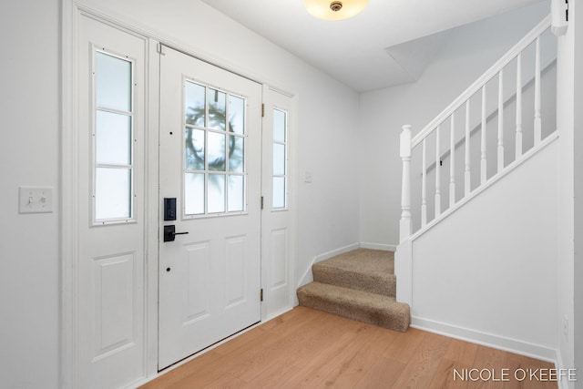 7745 Worthing Ct SW, Byron Center, MI 49315 - foyer entrance featuring light wood finished floors and stairway