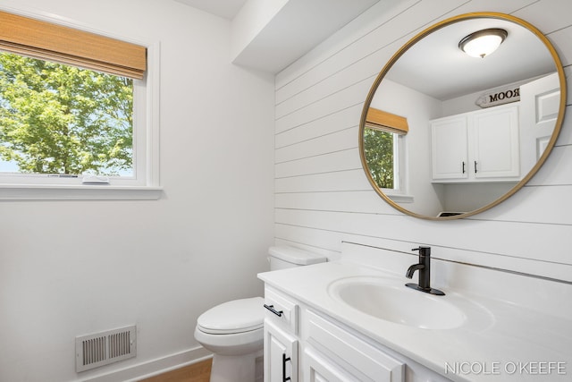 7745 Worthing Ct SW, Byron Center, MI 49315 - bathroom with plenty of natural light, vanity, and wood finished floors