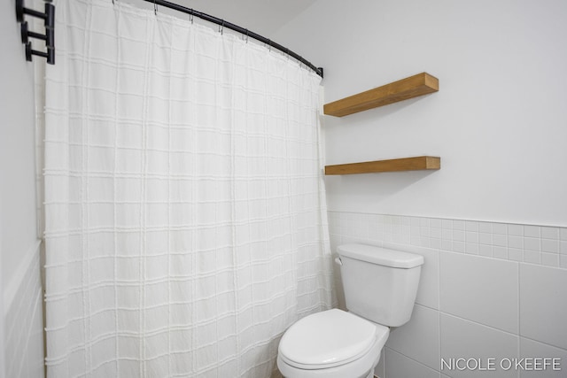 7745 Worthing Ct SW, Byron Center, MI 49315 - full bathroom with tile walls and a shower with curtain