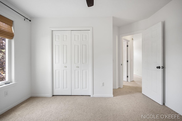 7745 Worthing Ct SW, Byron Center, MI 49315 - unfurnished bedroom featuring carpet flooring, a closet, and a ceiling fan