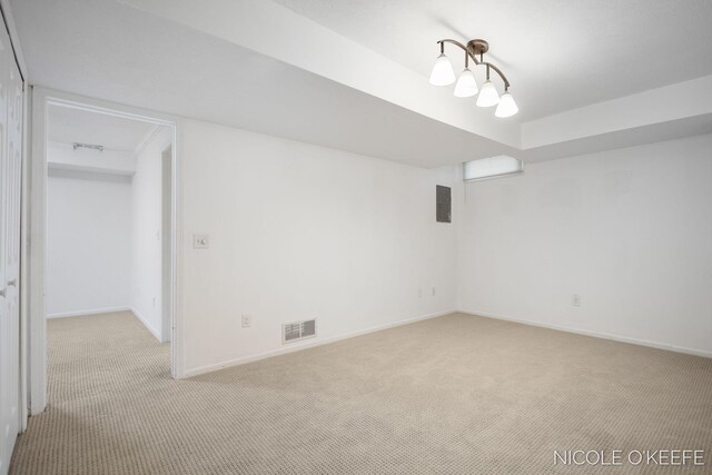 7745 Worthing Ct SW, Byron Center, MI 49315 - empty room featuring light carpet and electric panel
