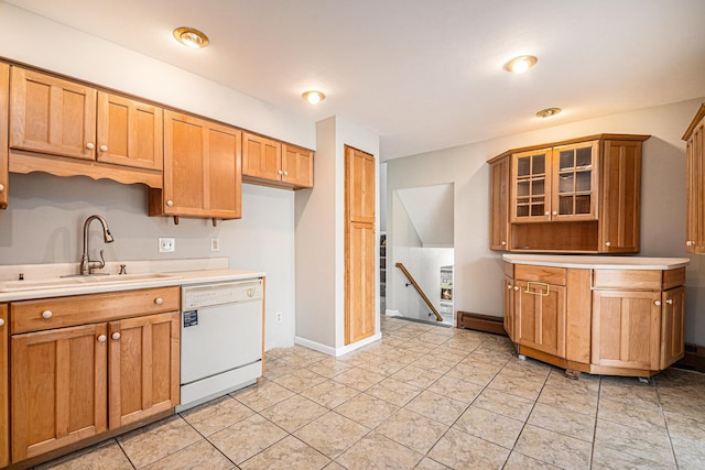 823 W Park Dr, Niles, MI 49120 - kitchen featuring dishwasher, a sink, light countertops, glass insert cabinets, and light tile patterned floors
