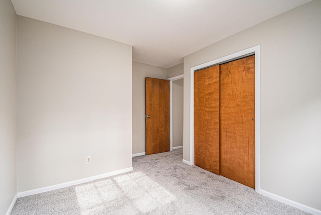 823 W Park Dr, Niles, MI 49120 - unfurnished bedroom featuring carpet flooring, a closet, and baseboards