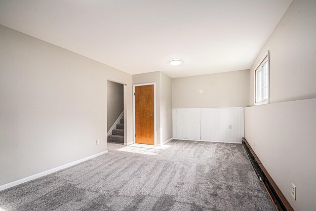 823 W Park Dr, Niles, MI 49120 - empty room featuring carpet, stairs, and baseboards