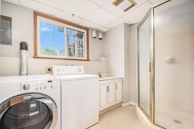 823 W Park Dr, Niles, MI 49120 - laundry area with washer and clothes dryer, cabinet space, and baseboards