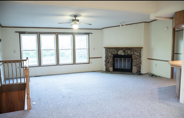 6340 Warren Woods Rd, Three Oaks, MI 49128 - unfurnished living room with carpet flooring, ornamental molding, ceiling fan, and a stone fireplace