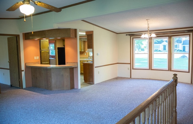 6340 Warren Woods Rd, Three Oaks, MI 49128 - kitchen featuring carpet flooring, freestanding refrigerator, ornamental molding, a ceiling fan, and a chandelier