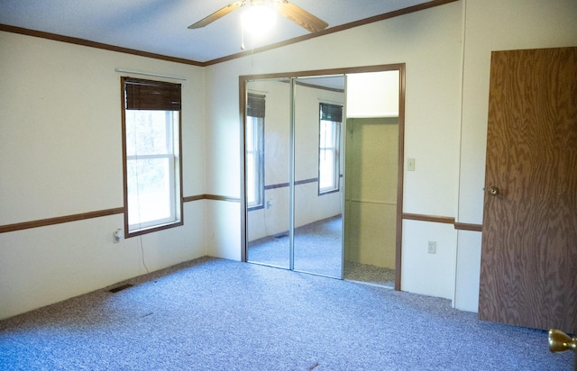6340 Warren Woods Rd, Three Oaks, MI 49128 - unfurnished bedroom with carpet flooring, crown molding, a ceiling fan, and a closet
