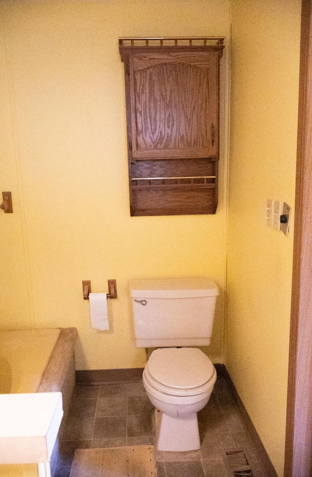 6340 Warren Woods Rd, Three Oaks, MI 49128 - bathroom with toilet, baseboards, and tile patterned floors