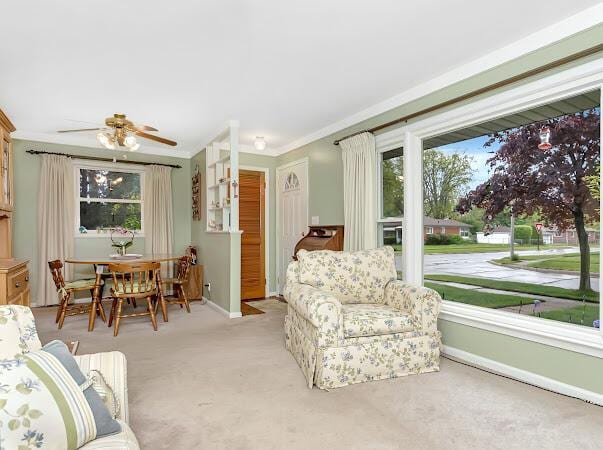 23165 Church St, Oak Park, MI 48237 - carpeted living area with baseboards, ceiling fan, and crown molding