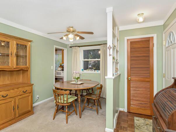 23165 Church St, Oak Park, MI 48237 - dining space with ceiling fan, baseboards, and ornamental molding