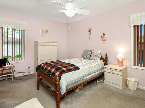 23165 Church St, Oak Park, MI 48237 - bedroom featuring light carpet and ceiling fan