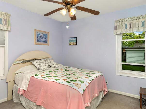 23165 Church St, Oak Park, MI 48237 - carpeted bedroom featuring baseboards and a ceiling fan