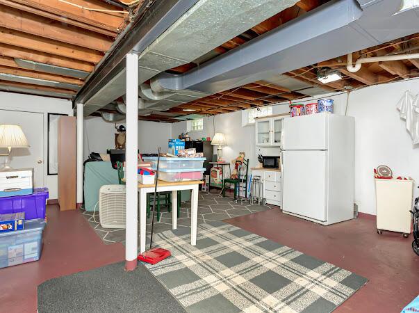 23165 Church St, Oak Park, MI 48237 - unfinished below grade area with freestanding refrigerator