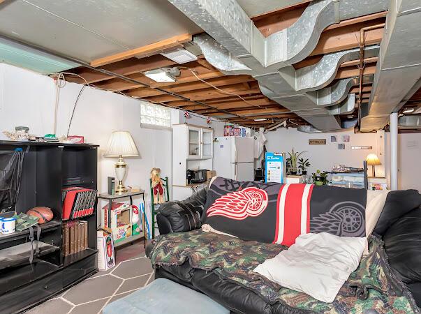 23165 Church St, Oak Park, MI 48237 - below grade area featuring freestanding refrigerator