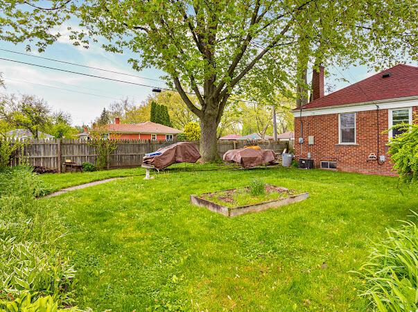 23165 Church St, Oak Park, MI 48237 - view of yard featuring central air condition unit