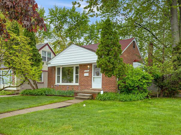23165 Church St, Oak Park, MI 48237 - bungalow-style home featuring brick siding and a front lawn