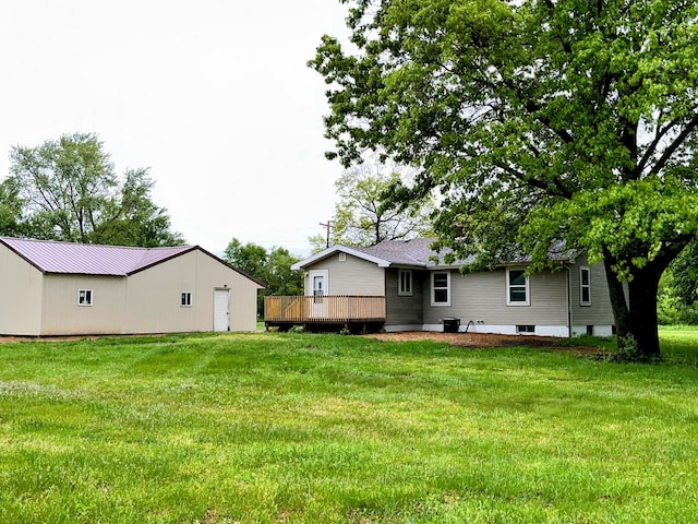 70025 Union Rd, Union, MI 49130 - rear view of house featuring a wooden deck and a lawn