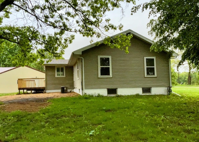 70025 Union Rd, Union, MI 49130 - back of property with a deck, a lawn, and central air condition unit