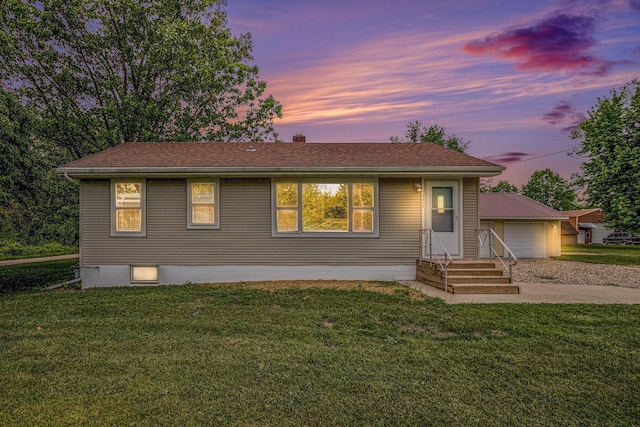 70025 Union Rd, Union, MI 49130 - view of front of home featuring a garage, a yard, driveway, and roof with shingles