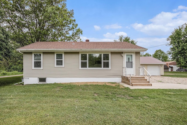 70025 Union Rd, Union, MI 49130 - view of front of home with a detached garage, a front yard, a shingled roof, and a chimney