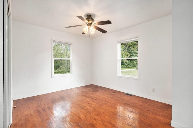 70025 Union Rd, Union, MI 49130 - spare room featuring healthy amount of natural light, ceiling fan, hardwood / wood-style floors, and baseboards