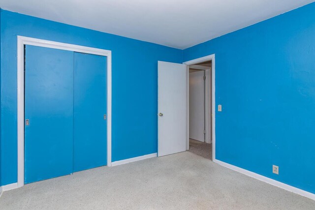 455 N Centre St, Schoolcraft, MI 49087 - unfurnished bedroom with carpet floors, a closet, and baseboards