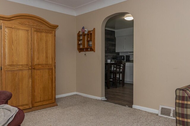455 N Centre St, Schoolcraft, MI 49087 - living area with baseboards, light colored carpet, and arched walkways