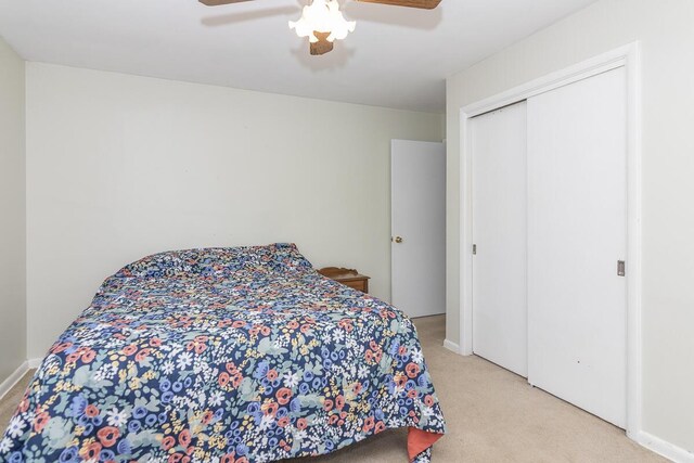 455 N Centre St, Schoolcraft, MI 49087 - bedroom with light colored carpet, a ceiling fan, and a closet