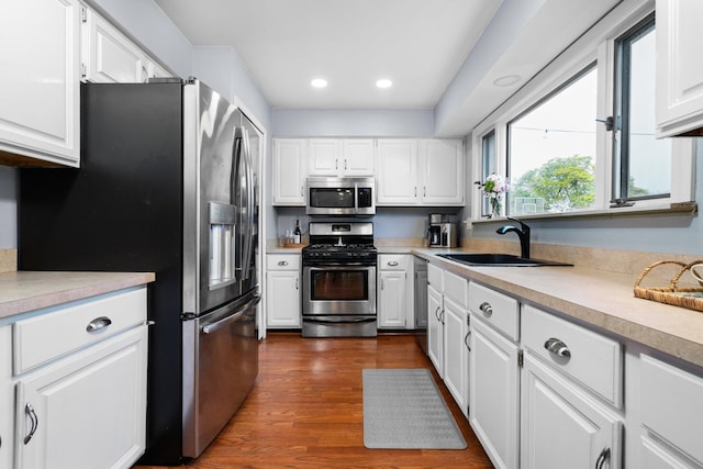 927 Queens Way, Canton, MI 48188 - kitchen featuring appliances with stainless steel finishes, a sink, light countertops, white cabinets, and recessed lighting
