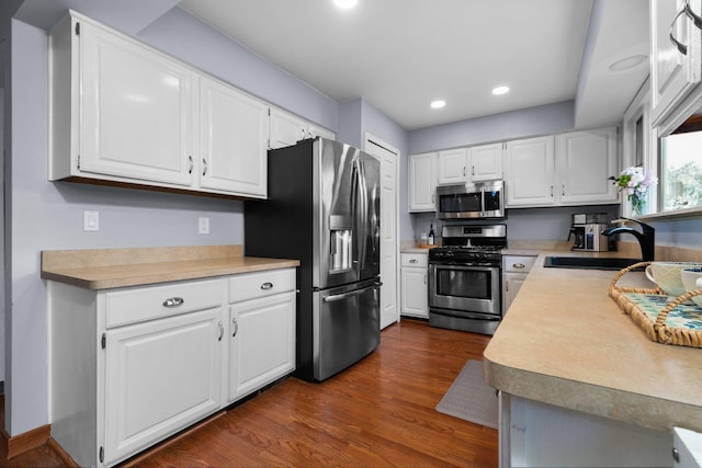 927 Queens Way, Canton, MI 48188 - kitchen featuring stainless steel appliances, a sink, dark wood-style flooring, light countertops, and recessed lighting