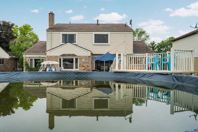 927 Queens Way, Canton, MI 48188 - back of house with a chimney, a deck, roof with shingles, and brick siding