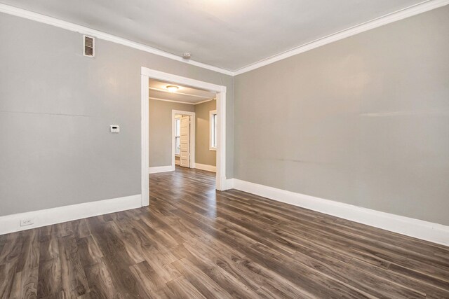 407 11th St NW Unit 409, Grand Rapids, MI 49504 - empty room with crown molding, dark wood-style floors, and baseboards