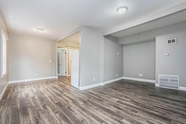 407 11th St NW Unit 409, Grand Rapids, MI 49504 - unfurnished room featuring dark wood-style floors and baseboards