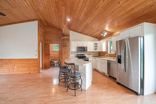884 N Gavord Rd, Sterling, MI 48659 - kitchen featuring stainless steel appliances, wood ceiling, a breakfast bar, white cabinetry, and light wood finished floors