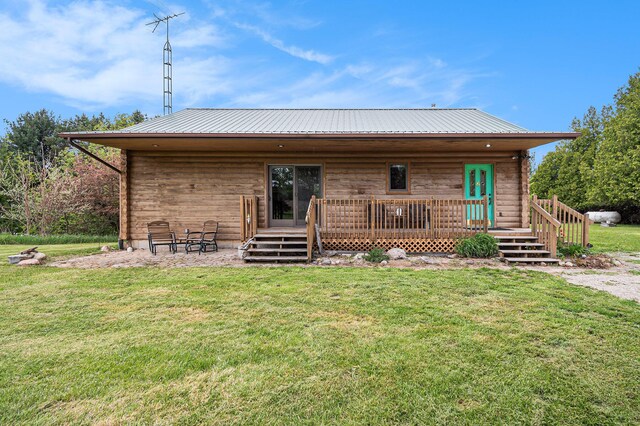 884 N Gavord Rd, Sterling, MI 48659 - rear view of property featuring a yard and metal roof