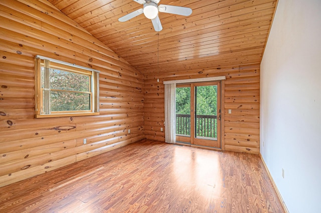 884 N Gavord Rd, Sterling, MI 48659 - empty room featuring vaulted ceiling, wood ceiling, log walls, wood finished floors, and a ceiling fan